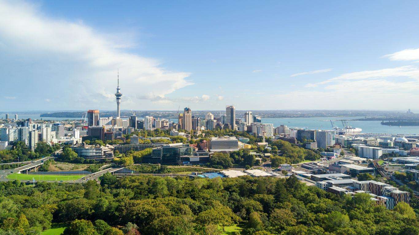 Auckland skyline with lush greenery.